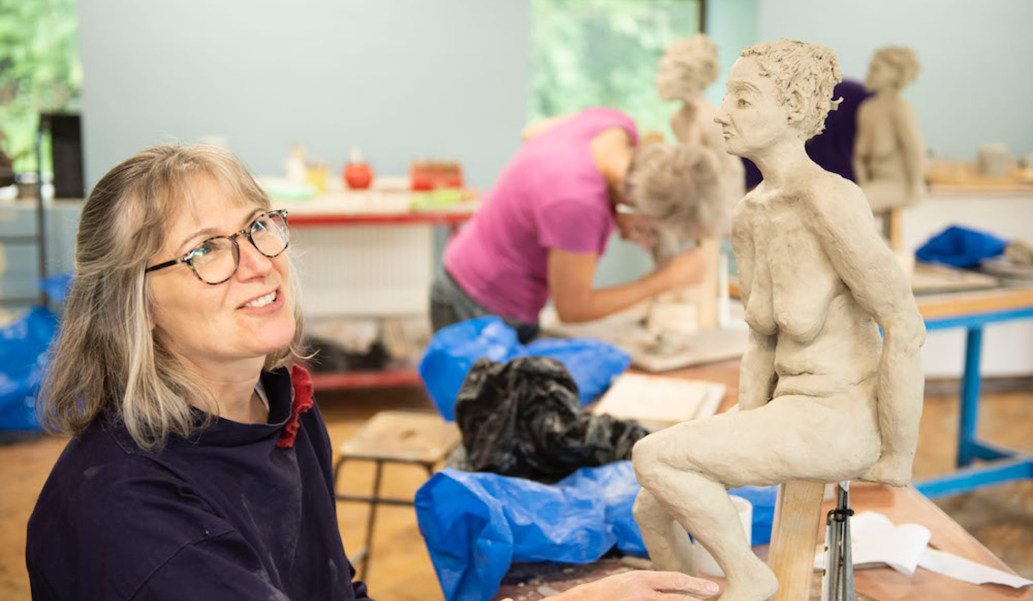 Clay sculpture class in progress at Sculpture Lounge Studio
