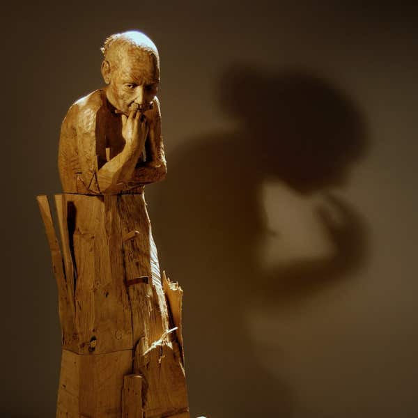 carved wooden figure by jamie frost