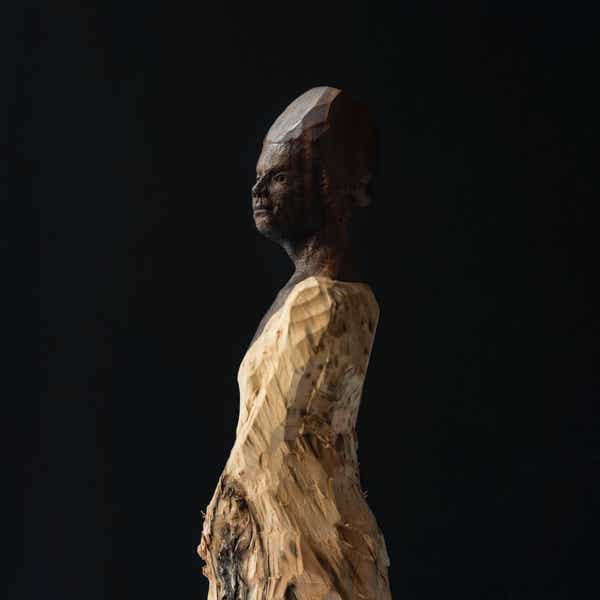 wooden figure sculpture by jamie frost