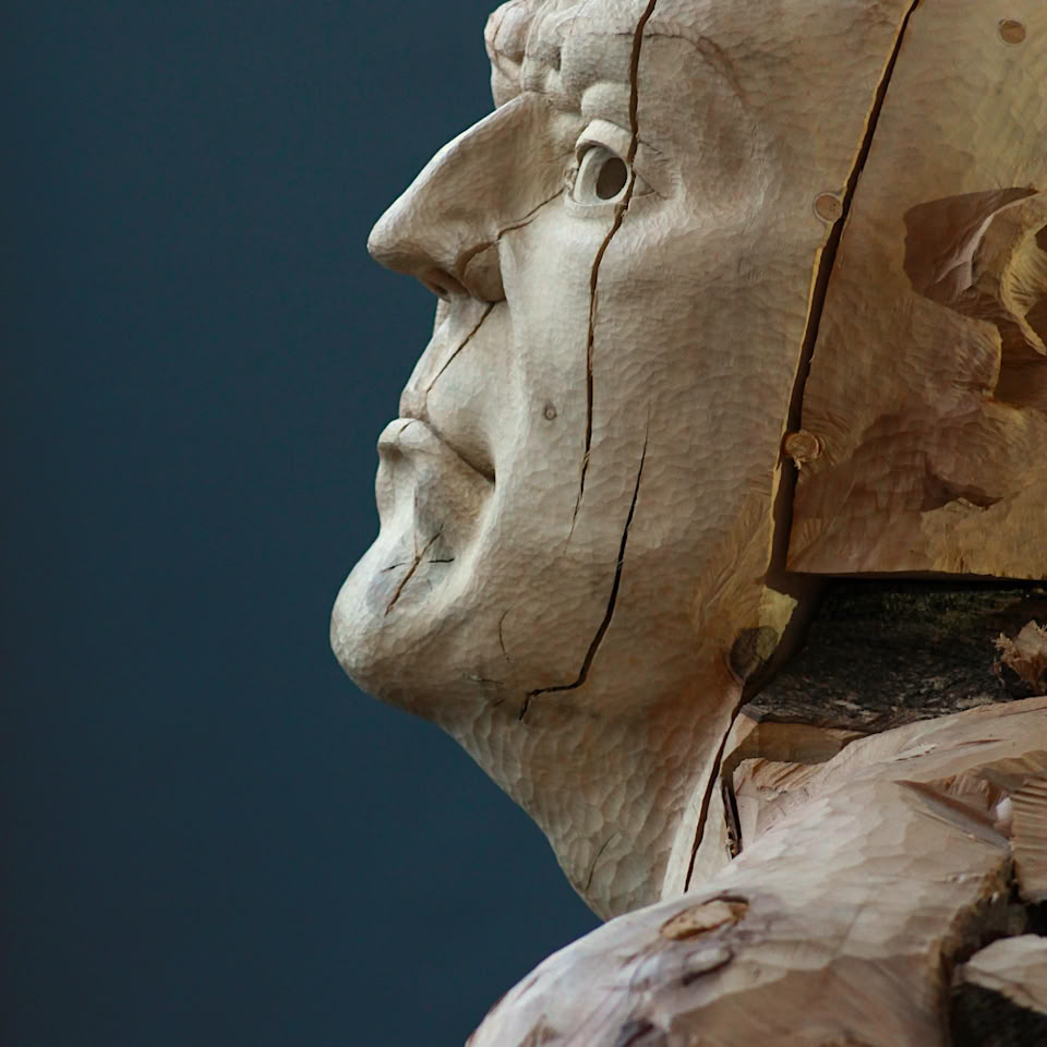 carved wooden figure by jamie frost