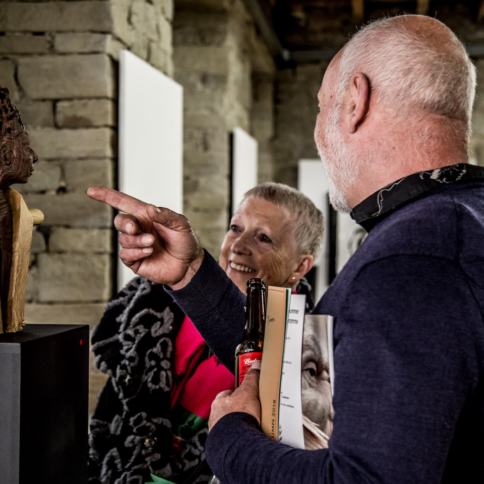 vistors to Jamie frost's The Way of All Flesh exhibition