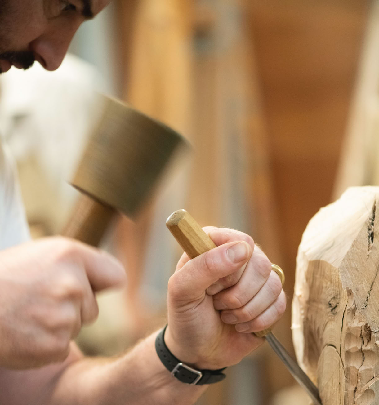 Mallet and Chisel carving wood.