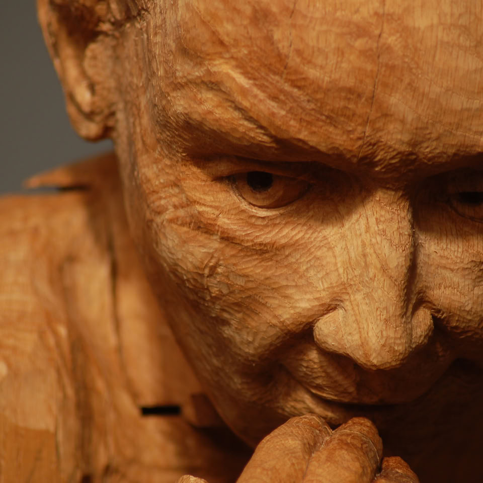 carved wooden figure by jamie frost